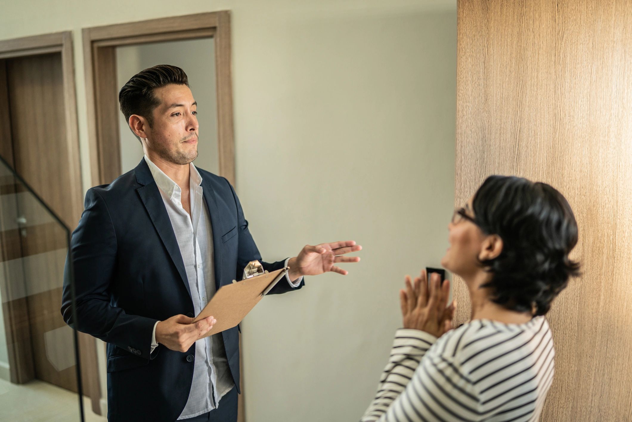 Agent discussing a rental showing with a client