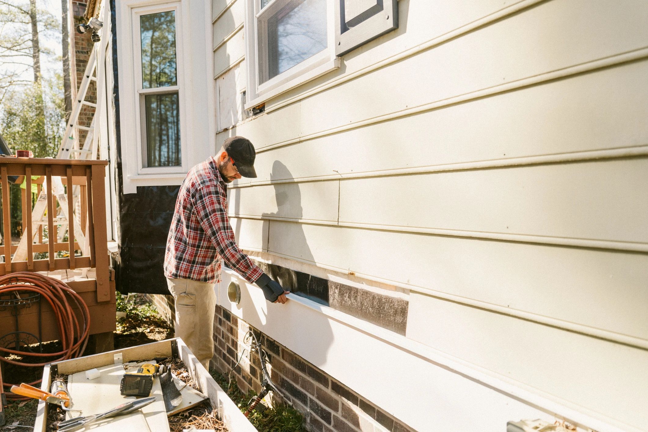 Exterior repair work being completed on a residential property
